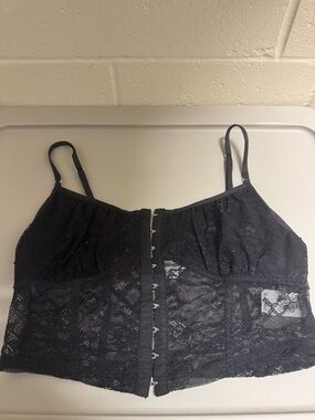 Garage black lace corset top with adjustable straps and hooks closure. Size: S